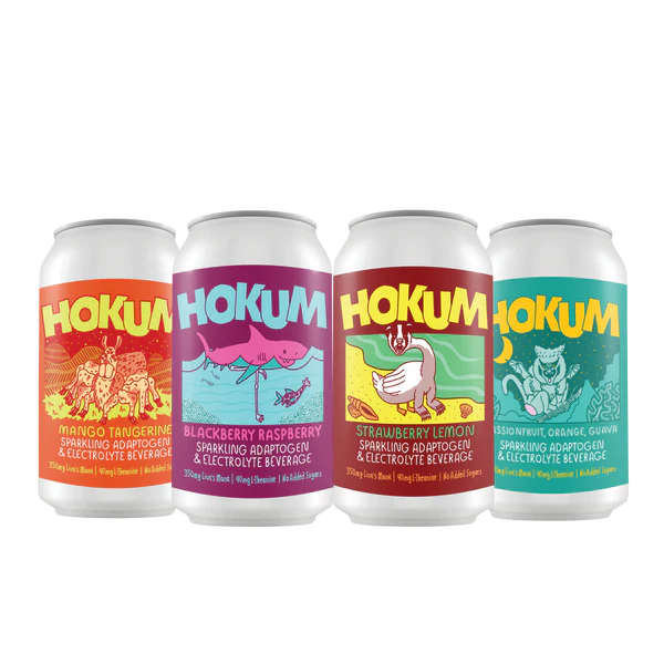 Four cans of Hokum drinks with colorful labels on a white background